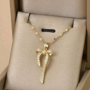 Gold Bow Pendant Necklace with Crystal Accents